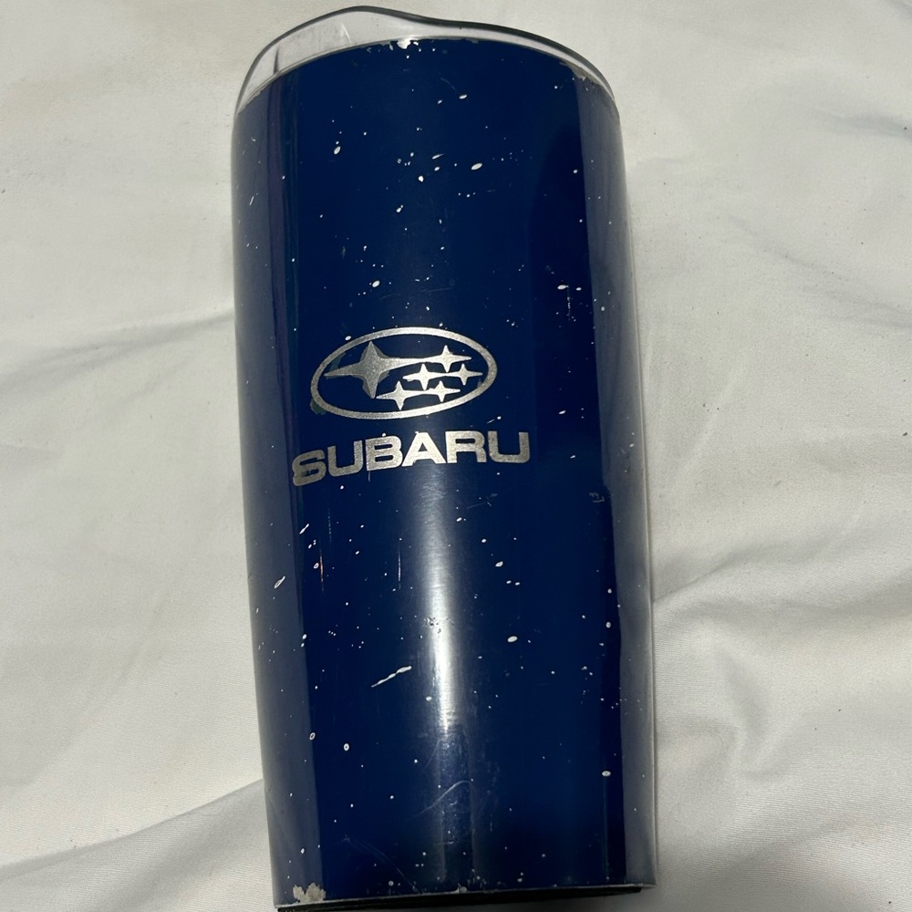 A blue Subaru cup